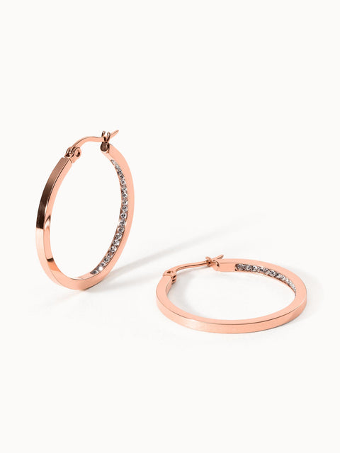 Roségoldene Creolen mit funkelnden Steinen, elegant und modern, von PURELEI.