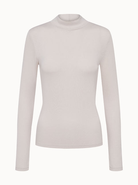 Elegantes, langärmliges Oberteil in sanftem Beige von PURELEI, schlicht und feminin.