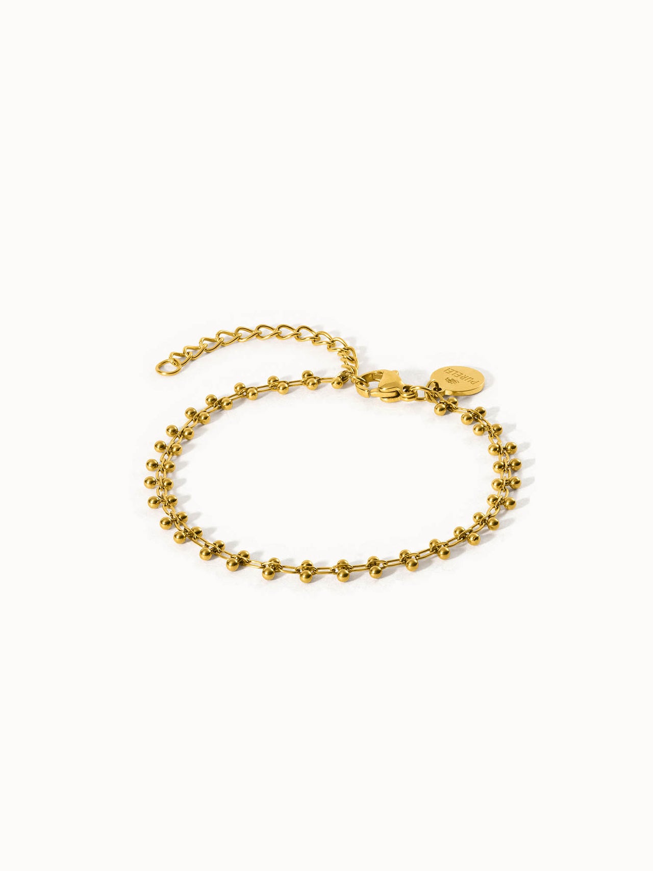 Goldenes Armband mit Kugeldetails von PURELEI, elegant und feminin.