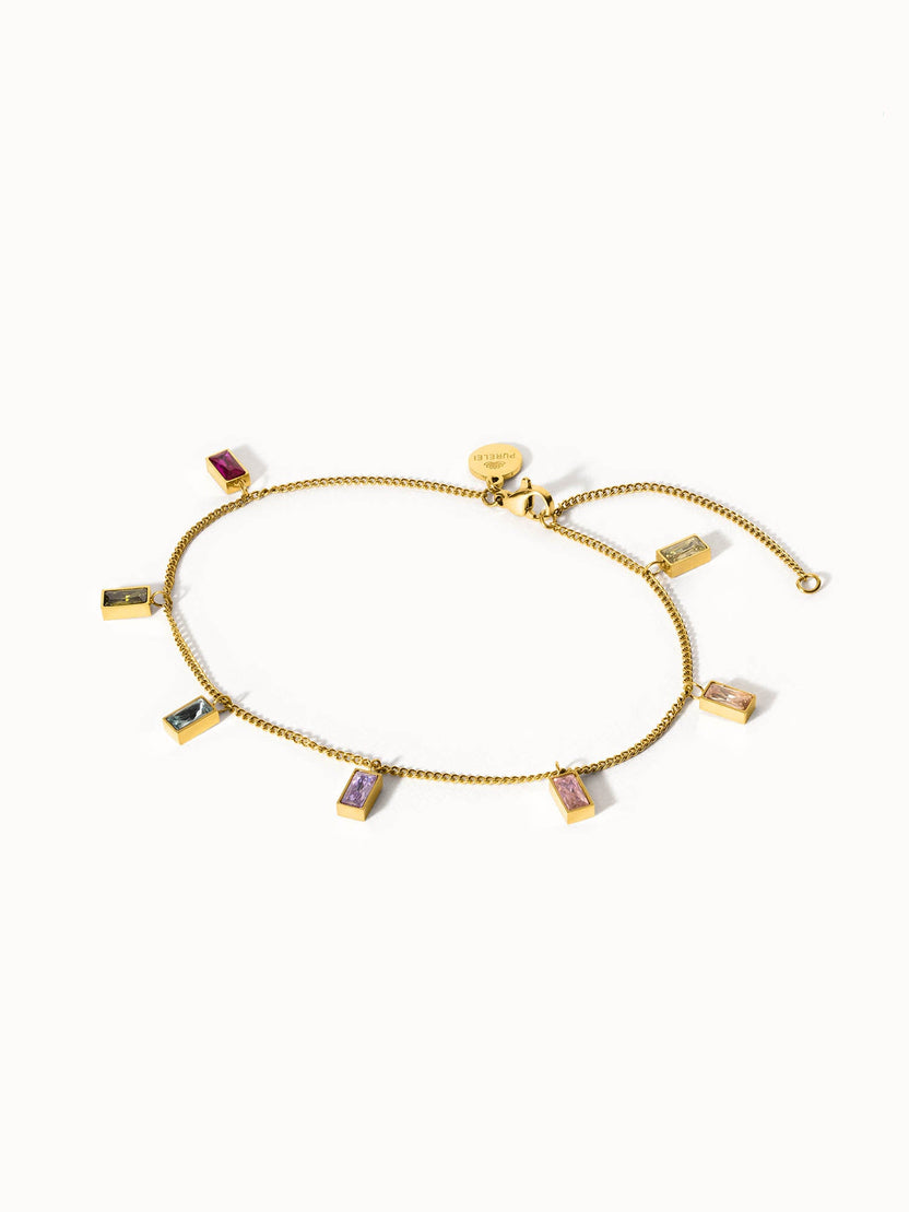 Rainbow Fusskettchen von PURELEI mit 18K vergoldetem Edelstahl und bunten Zirkonia-Steinen, elegant und lebensfroh.