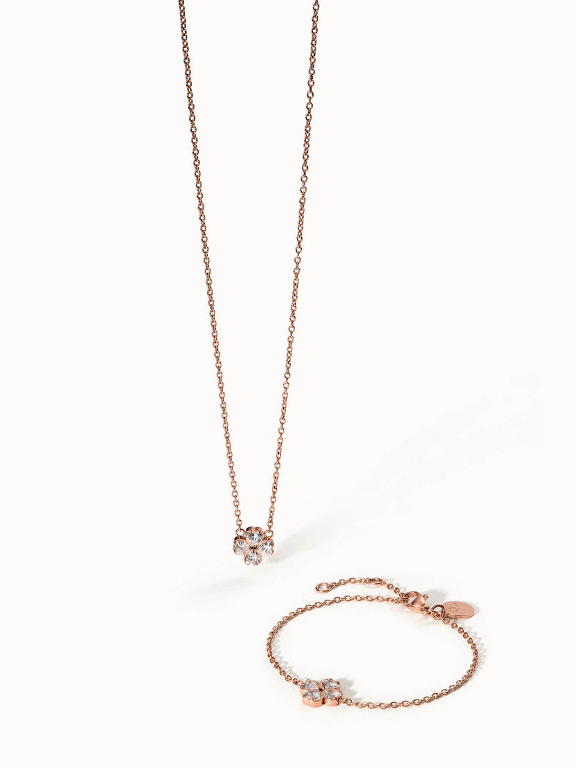 Roségoldene Kette und Armband mit blütenförmigem Kristallanhänger von PURELEI.