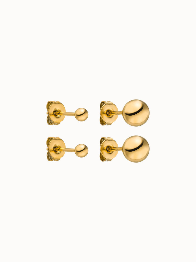 Goldene Ohrringe mit glänzenden Kugeldesigns von PURELEI, elegant und modern.