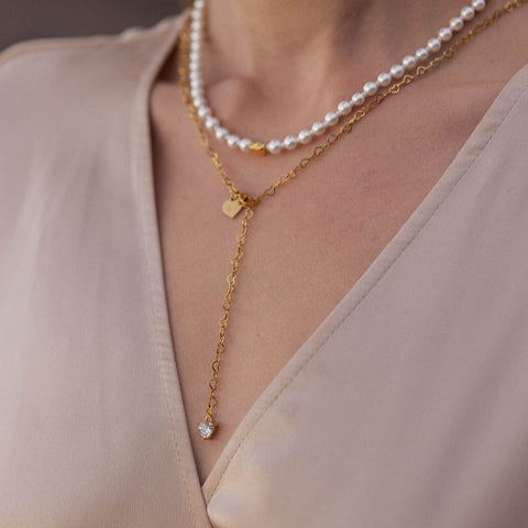 Zarte PURELEI Kette aus Roségold mit Muscheln und Herzanhänger, elegant und feminin.